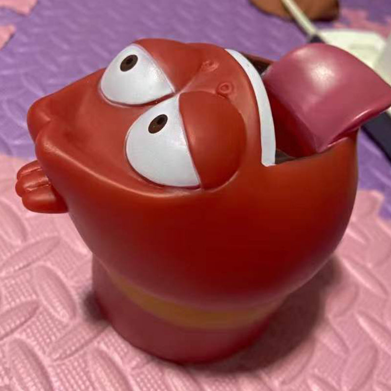 Personnages de dessins anime qui s'accroche au robinet